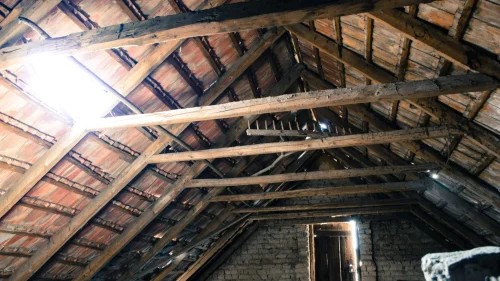 Roofing contractor discussing roof inspection findings with homeowner