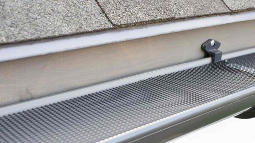 Drip edge directing water into a gutter