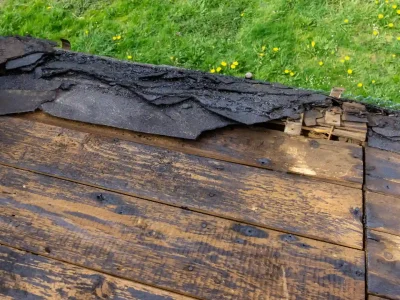 Residential roof with exposed roof decking during roof replacement