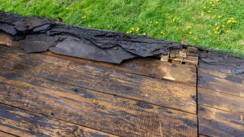 Residential roof with exposed roof decking during roof replacement