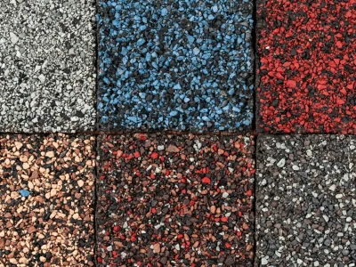 Close-up of asphalt shingles samples on a table during consultation
