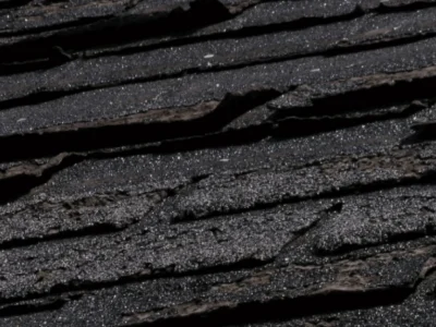 Severely cracked and splitting asphalt shingles from temperature expansion and contraction