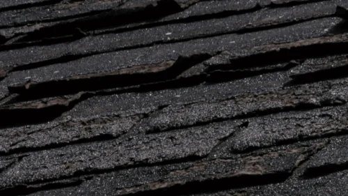 Severely cracked and splitting asphalt shingles from temperature expansion and contraction